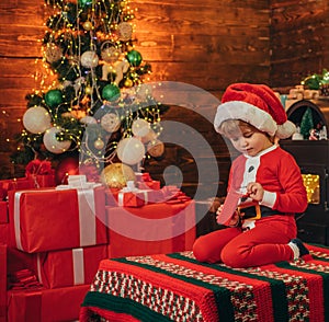 Santa boy little child celebrate christmas at home. Childhood memories. Family holiday. Boy cute child cheerful mood