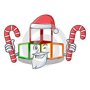 Santa with candy toy blocks on cube boxes mascot