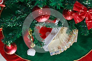 Santa cap with money brazilian. Money for Christmas gifts or gift money. Christmas Concept
