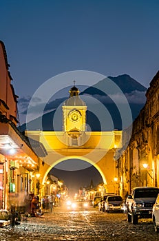 Arco de Santa Catalina and Volcan de Agua in Antigua Guatemala, Central America photo