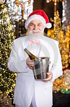 For Santa. cheers. offer chilled good wine. tuxedo senior sommelier. new year night might be long. merry christmas to