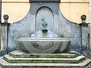 Santa Chiara street`s fountain in Turin city, Italy. Art, history and mystery