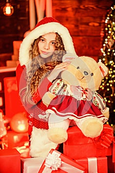 Santa child toy bear. kid with present box. winter shopping sale. having fun daughter exchanging gift. Christmas scene