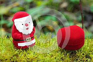 Santa with christmas gifts on the moss