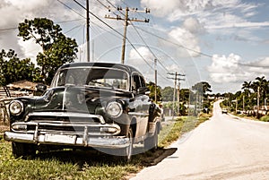 American black 1951 vintage car on the country road in Quintin Banderas to the city Santa photo
