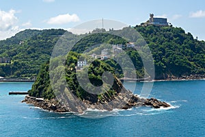 Santa Clara island and Igueldo mountain in the bay of Donostia-San Sebastian, Spain photo