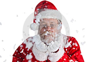 Santa claus blowing fake snow