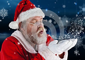 Santa claus blowing a snow