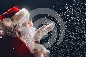 Santa Claus blows snow.