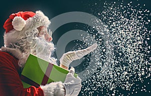 Santa Claus blows snow