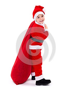 Santa Claus boy carrying gift bag