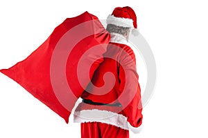 Santa claus carrying bag full of gifts