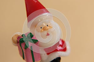 Santa Claus is carrying gift packages. yellow background