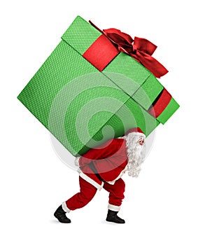 Santa Claus carrying huge gift isolated on white