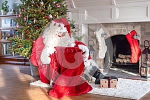 Santa Claus checking his bag for gifts