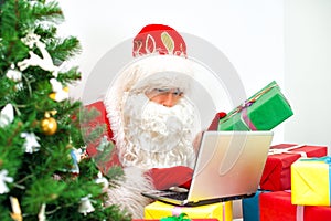 Santa Claus checking wish list.