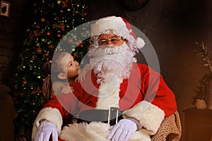 Santa Claus and child at home. Christmas gift. Family holiday concept