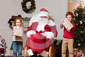 Santa claus and children with presents