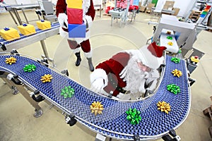 Santa claus at christmas ornament production line