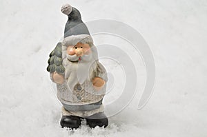 Santa Claus with Christmas tree on Snow Background, horizontal