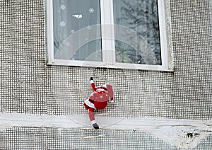 Santa claus climbs out the window