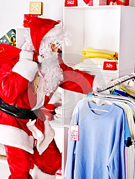 Santa Claus in clothing store.