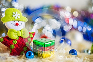 Santa claus with colorful gift and blue green red gold ball decoration on chrismas