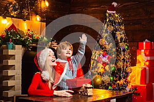 Santa claus coming. Mother and little child boy adorable friendly family having fun. Family having fun at home christmas