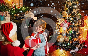 Santa claus coming. Mother and little child boy adorable friendly family having fun. Family having fun at home christmas