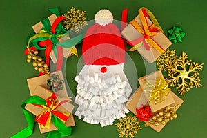 Santa Claus concept. Christmas New Year 2022 flat lay on green background, gift present boxex. decoration, traditional greeting