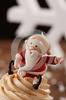 Santa Claus cupcake detail on Christmas background