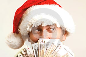 Santa claus with dollar money, isolated on white. Christmas, holidays, winning, currency and people concept. Santa holding cash. C