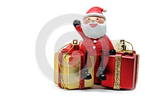 Santa Claus dolls and Christmas decorations box red and gold on white background