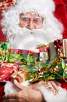 Santa Claus drinking tea Closeup Portrait Isolated on red