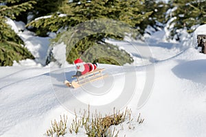 Santa Claus is driving down the mountain