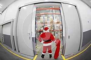 Santa Claus with empty sack doing wholesale shopp photo