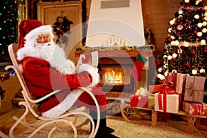 Santa Claus enjoying and reading children wishes for x-mas