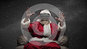 Santa Claus experiencing virtual reality photo