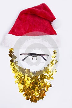 Santa Claus face decoration-red hat and golden beard isolated on white background. Merry Christmas, happy New Year.