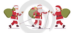 Santa Claus, Father Christmas skiing carrying heavy gift bag