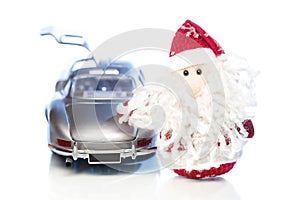 Santa Claus or Father Frost with old retro car