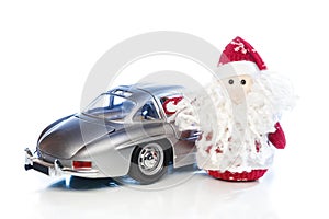 Santa Claus or Father Frost with old retro car