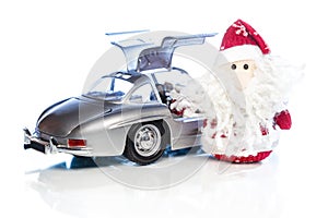 Santa Claus or Father Frost with old retro car