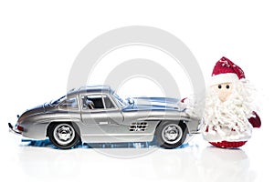 Santa Claus or Father Frost with old retro car