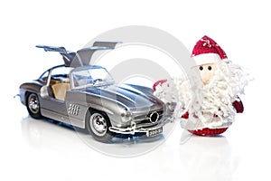 Santa Claus or Father Frost with old retro car