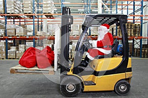 Santa Claus forklift operator in warehouse