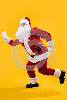 The Santa claus froze in runner pose