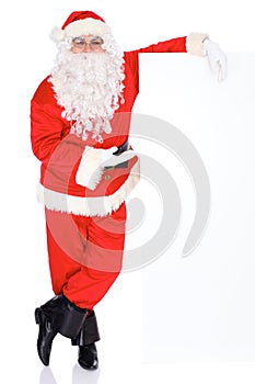 Santa Claus gesticulate while standing straight, isolated over white background. Winter Merry Christmas or New Year