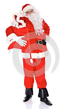 Santa Claus gesticulate while standing straight, isolated over white background. Winter Merry Christmas or New Year