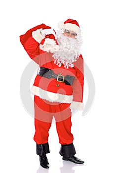 Santa Claus gesticulate while standing straight, isolated over white background. Winter Merry Christmas or New Year